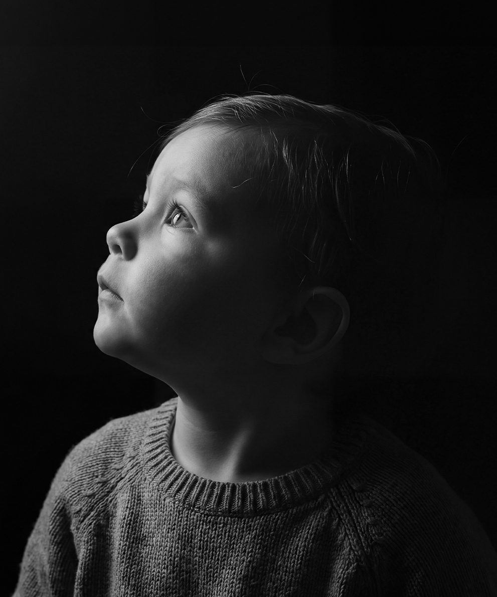 A child looking upward, representing the wonder of early development